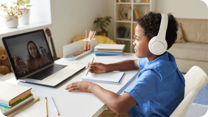 Student wearing headphones during an online tutoring session