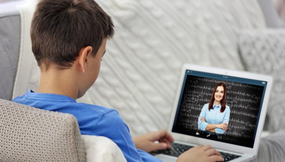 Boy participating in an online tutoring lesson